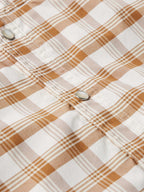 Tan-and-white plaid western snap shirt with metal snap at cuff, long sleeve.