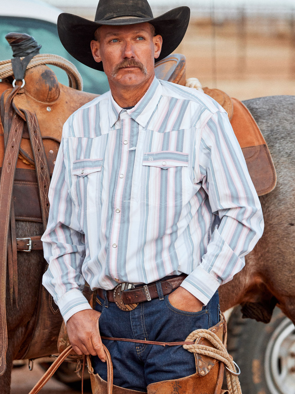 Mens western snap shirt, light blue and pink striped, with snap button front and pockets