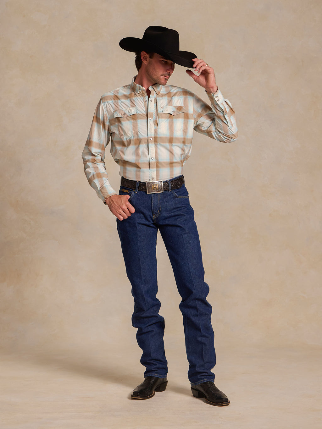 Western snap shirt in light blue and tan plaid with snap-front placket and chest pockets
