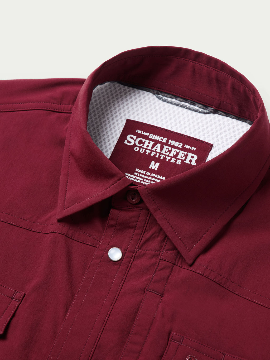 Maroon shirt collar with inner label and buttoned neckline