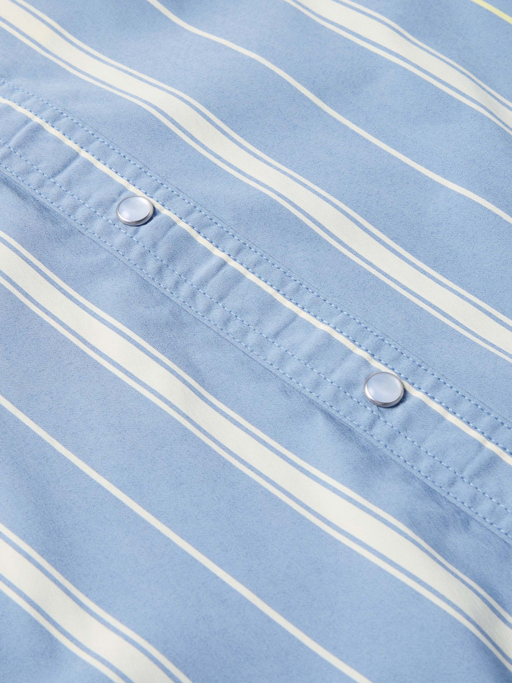 Light blue striped snap front shirt with two chest snap buttons