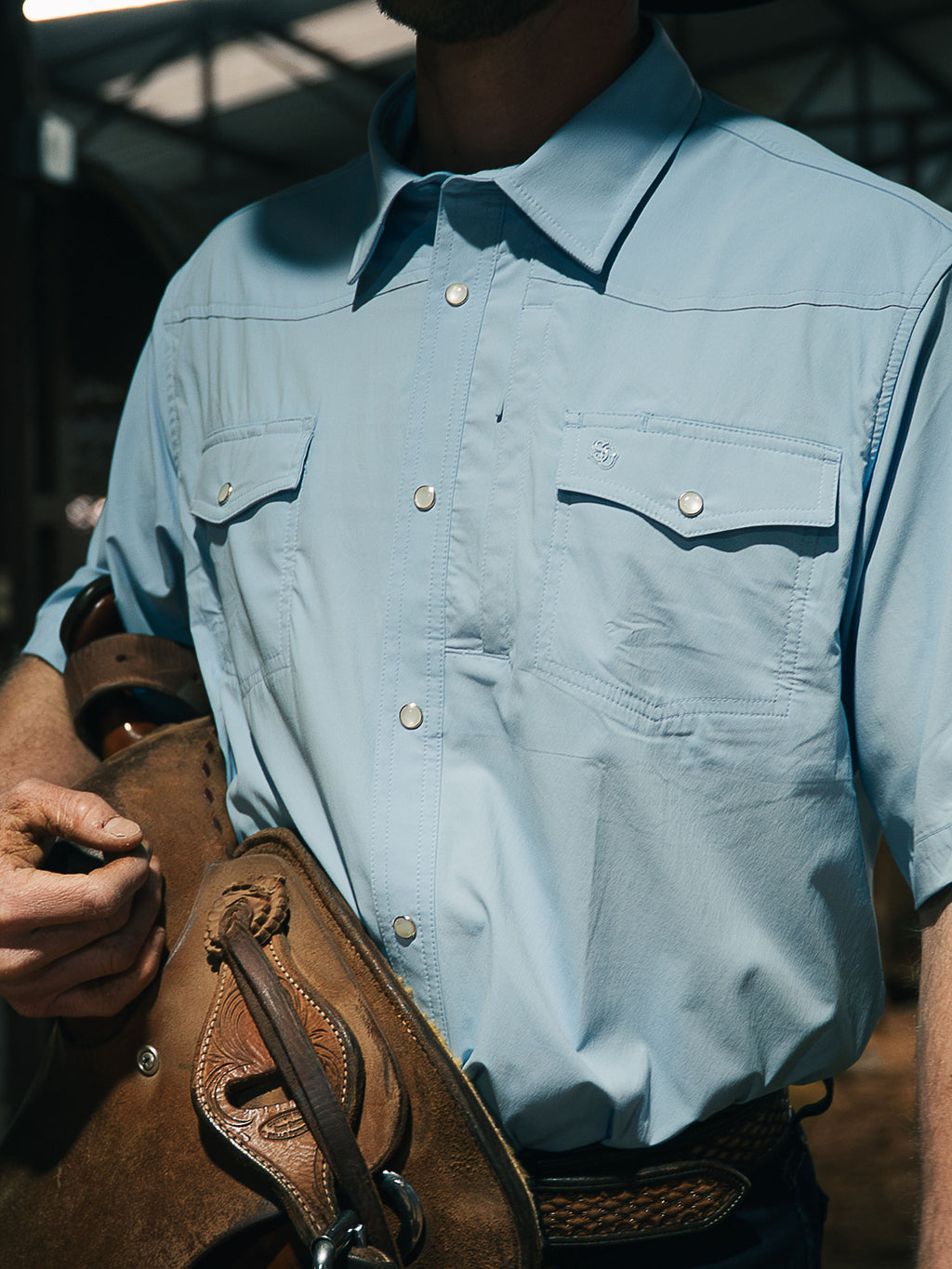 Sky blue short-sleeve snap western shirt with chest flap pockets
