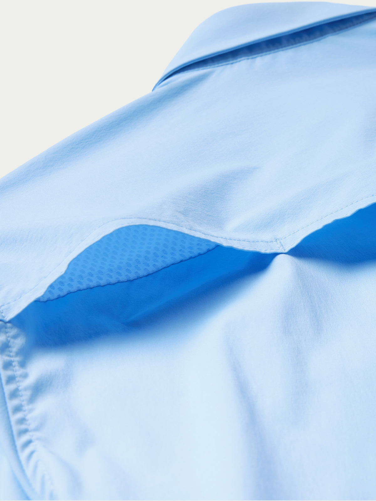 Light blue short-sleeve western snap shirt with shoulder yoke and curved seams