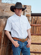 White short-sleeve snap western guide shirt with chest snaps, worn by model