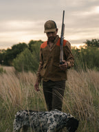 RangeWax® Mesquite vest on a hunter, brown body with orange shoulder yoke.