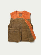 RangeWax® Mesquite vest angled view with orange shoulder panels and brown utility pockets.