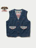 Blue denim vest with two chest flap pockets and colorful printed accents