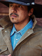 Sand brush jacket with button front, flap pockets, and dark collar lining detail