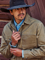 Sand brush jacket with button front and chest flap pockets, wearing hat