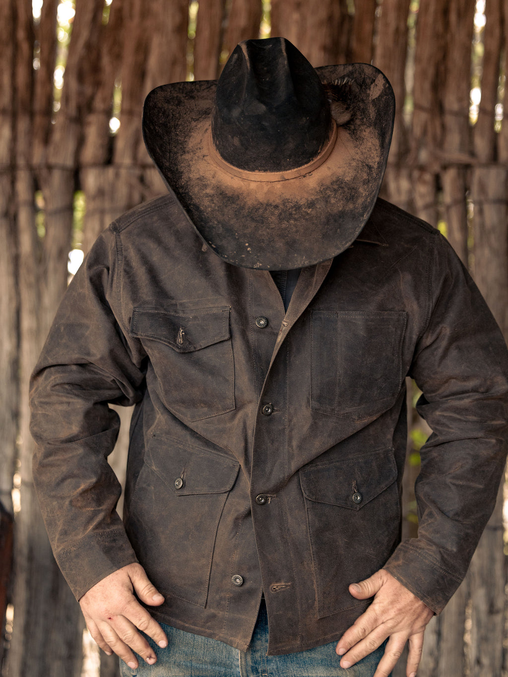Mesquite brush jacket on model, dark brown with button front and chest pockets