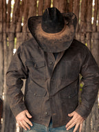 Mesquite brush jacket on model, dark brown with button front and chest pockets