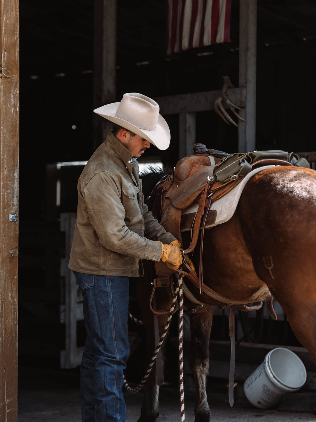 RangeWax® Mesquite brush jacket worn by cowboy, sand coat with snap front