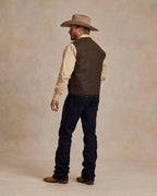Dark brown back view utility vest with flap pockets and button closure