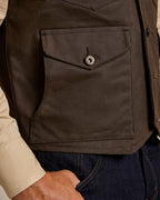 Dark brown vest with square patch pocket and metal snap button