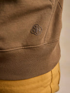 Olive cotton hoodie with embossed clover logo on sleeve cuff