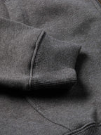 Heather charcoal hoodie cuff and sleeve hem with knit texture and stitching detail