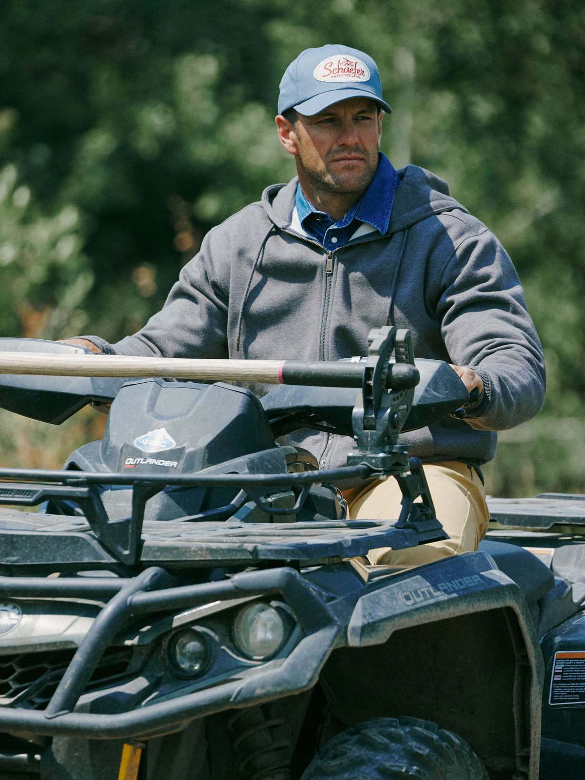 Heather charcoal full-zip hoodie worn by a man outdoors, front-facing view