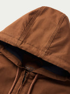 Russet hood edge close-up with navy lining and drawstring cords