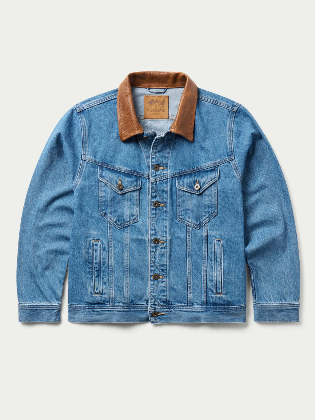 Medium indigo denim jacket with brown collar and chest flap pockets