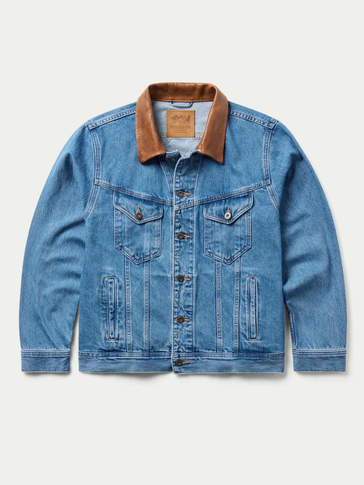 Medium indigo denim jacket with brown collar and chest flap pockets