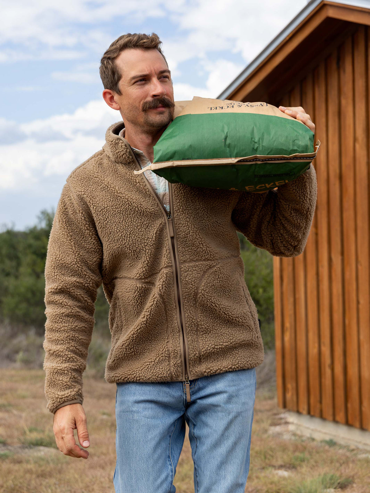 Taupe full-zip fleece jacket with zip front and side pockets