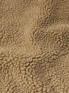 Taupe sherpa fleece texture close-up