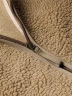 Taupe zip track with metal zipper pull on fleece jacket