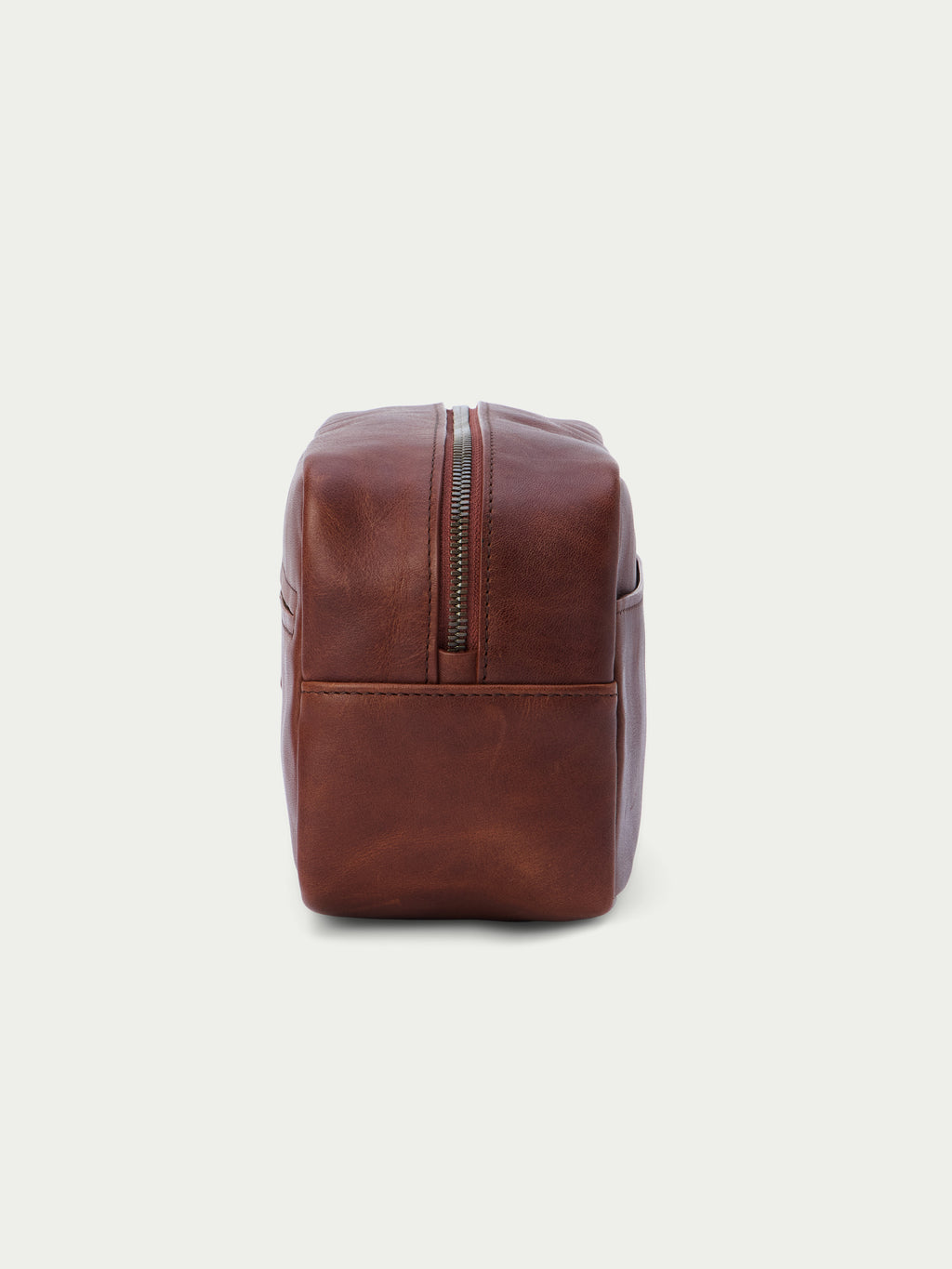 Russet leather dopp kit, structured rectangular shape with top zip
