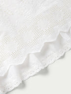 Vintage white skirt with embroidered eyelet texture and lace-trimmed hem