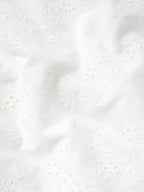 Vintage white skirt fabric with floral eyelet embroidery and scalloped detail