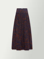 Long paisley print skirt in dark blue with rust tones, elastic waist and soft drape.