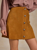 Tuscany suede mini skirt with front snaps and side slit hem