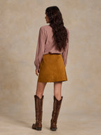 Tuscany suede mini skirt viewed from side with front button placket