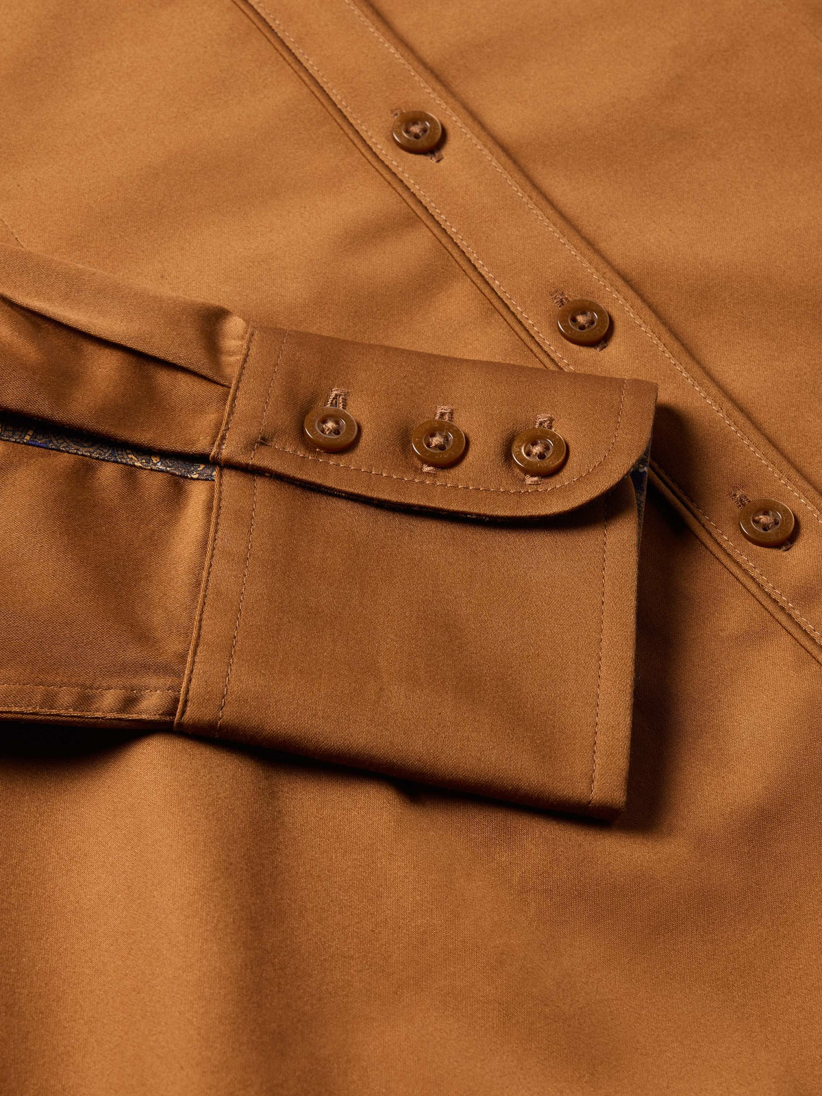 Women's Reata button-up shirt in dark caramel, front placket with brown buttons.