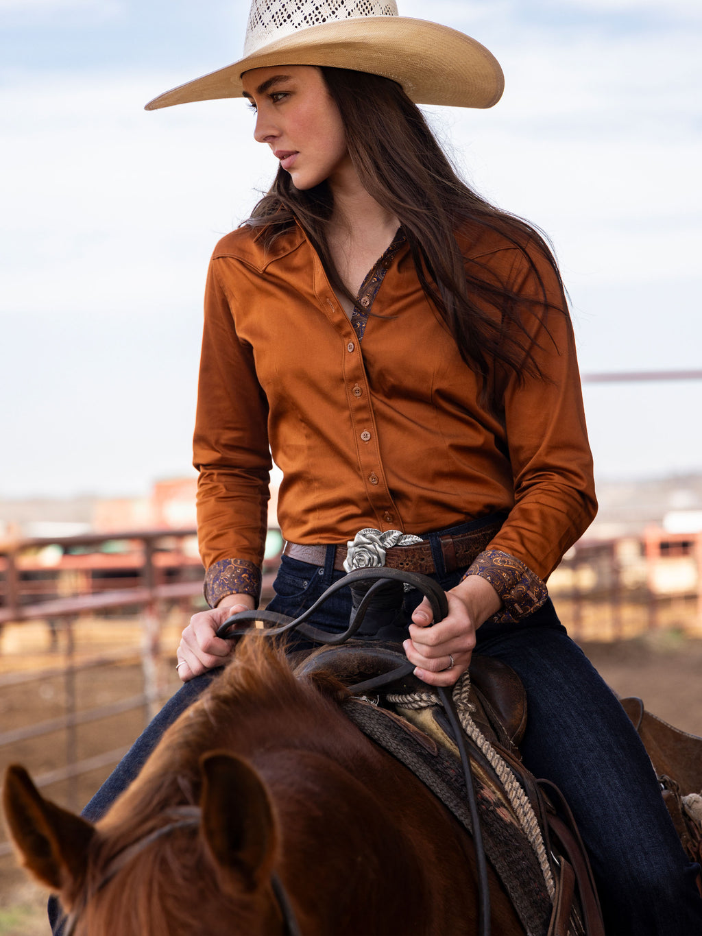 Women’s dark caramel button-up shirt with collared neckline and long sleeves