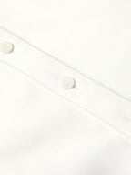 Close-up of white shirt button placket with round white buttons and stitched seams