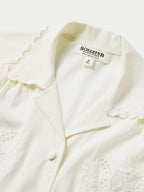 Vintage white blouse with scalloped collar trim, button placket, and embroidered accents