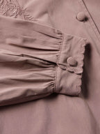 Washed plum blouse gathered cuff with scalloped trim and round button detail