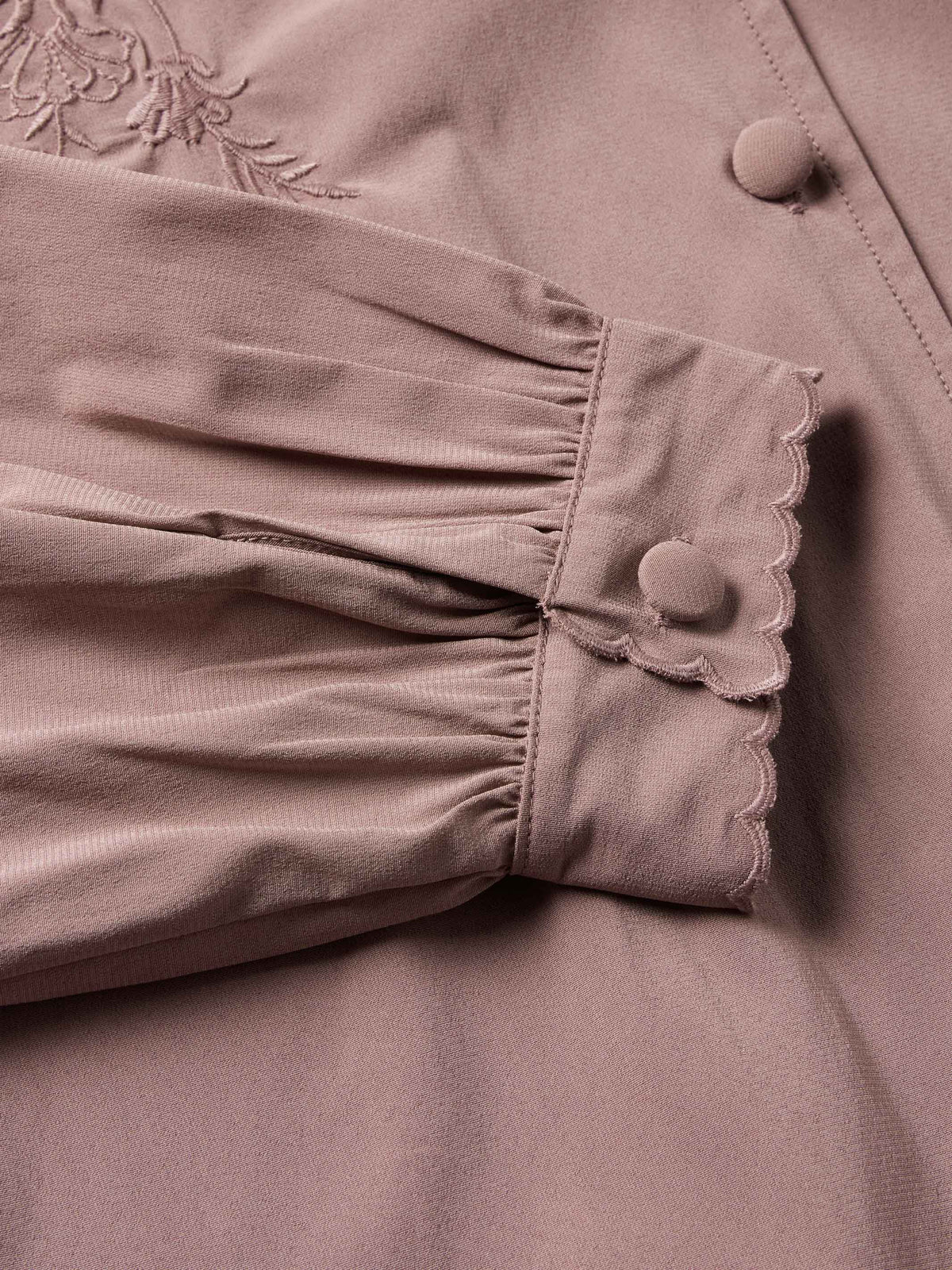 Washed plum blouse gathered cuff with scalloped trim and round button detail
