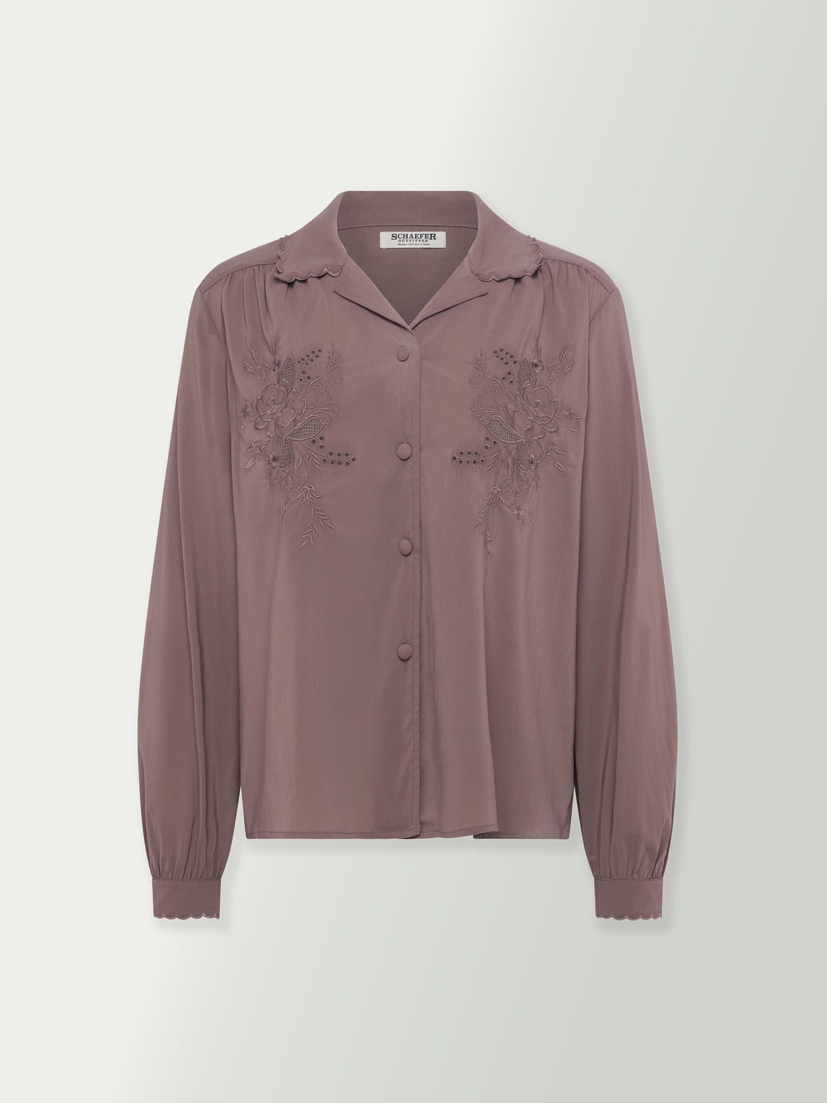 Washed plum blouse front with stand collar and lace-like embroidery on the chest