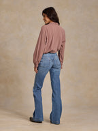 Washed plum blouse with long sleeves and button back