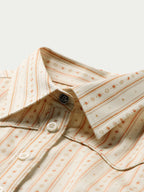 Women's printed button-up shirt collar and placket with white buttons