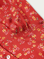 Red floral mini dress with gathered waist and short sleeves