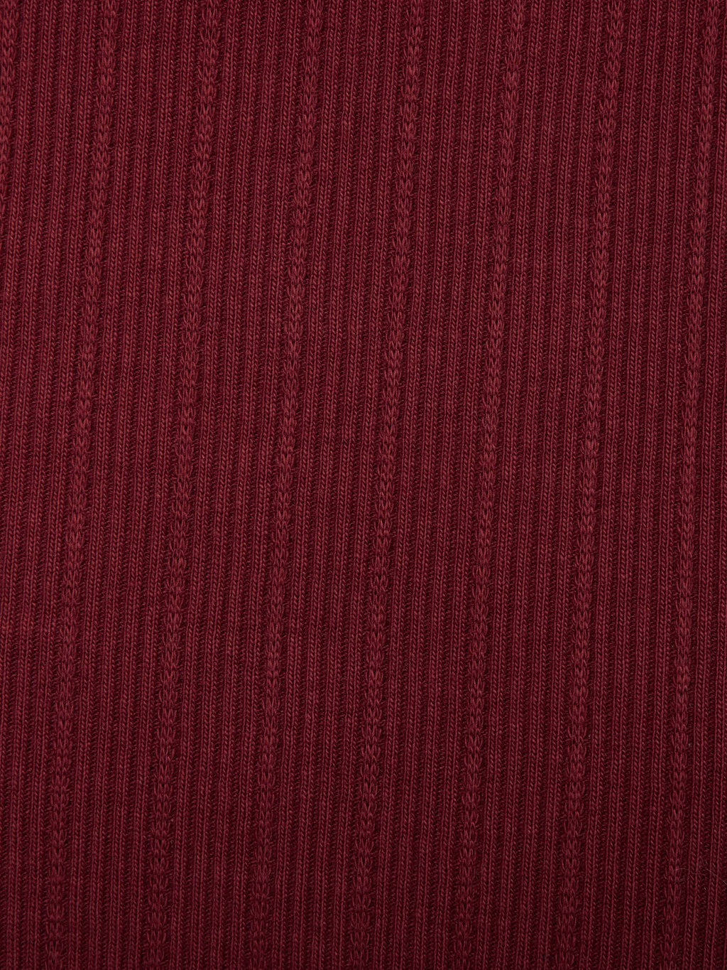 Wine ribbed knit fabric texture close-up