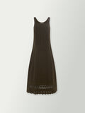 Olive sleeveless shift dress with lace-trimmed hem, angled view