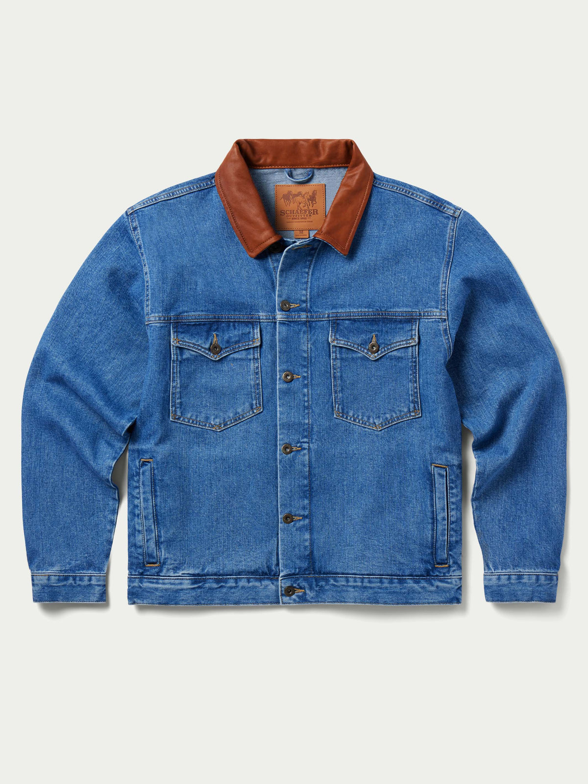 Men's medium indigo denim jacket front view with brown collar and two chest pockets