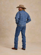 Medium indigo denim jacket with fleece lining, back view with yoke and seams