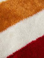 Striped fleece lining fabric with brown, white, and red textured stripes
