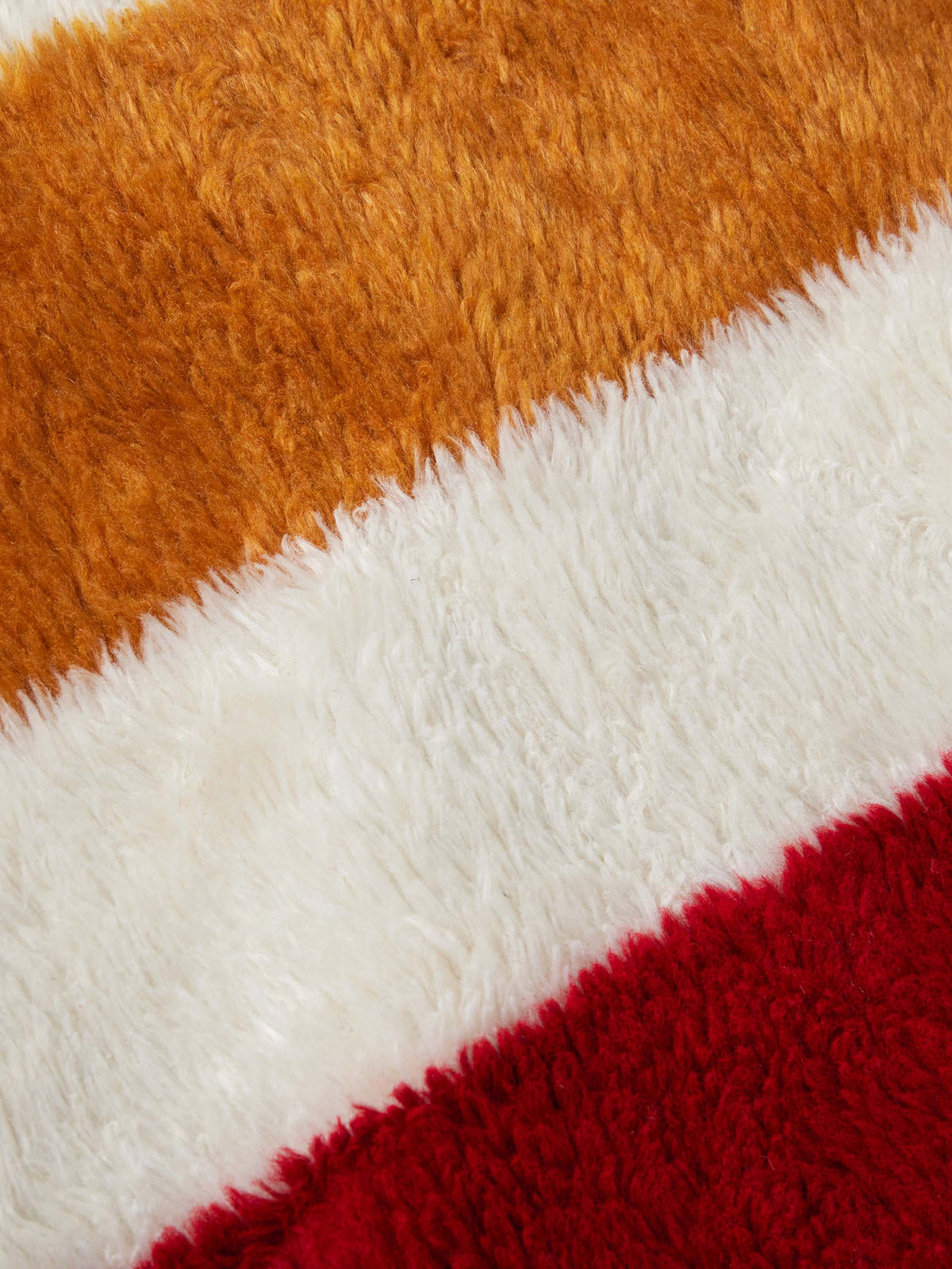 Striped fleece lining fabric with brown, white, and red textured stripes