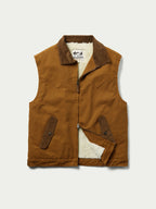 Tan canvas sherpa-lined vest with front zipper and two chest utility pockets